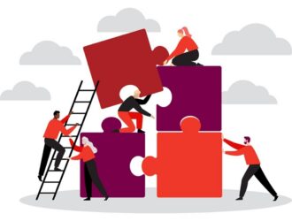 An illustration of people working together to assemble large puzzle pieces