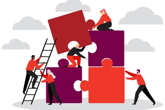 An illustration of people working together to assemble large puzzle pieces