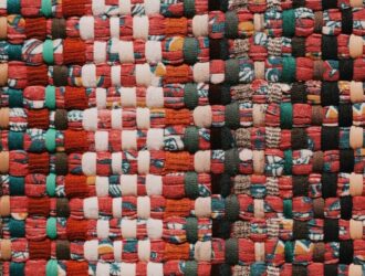 A close-up of colorful woven textile fabric